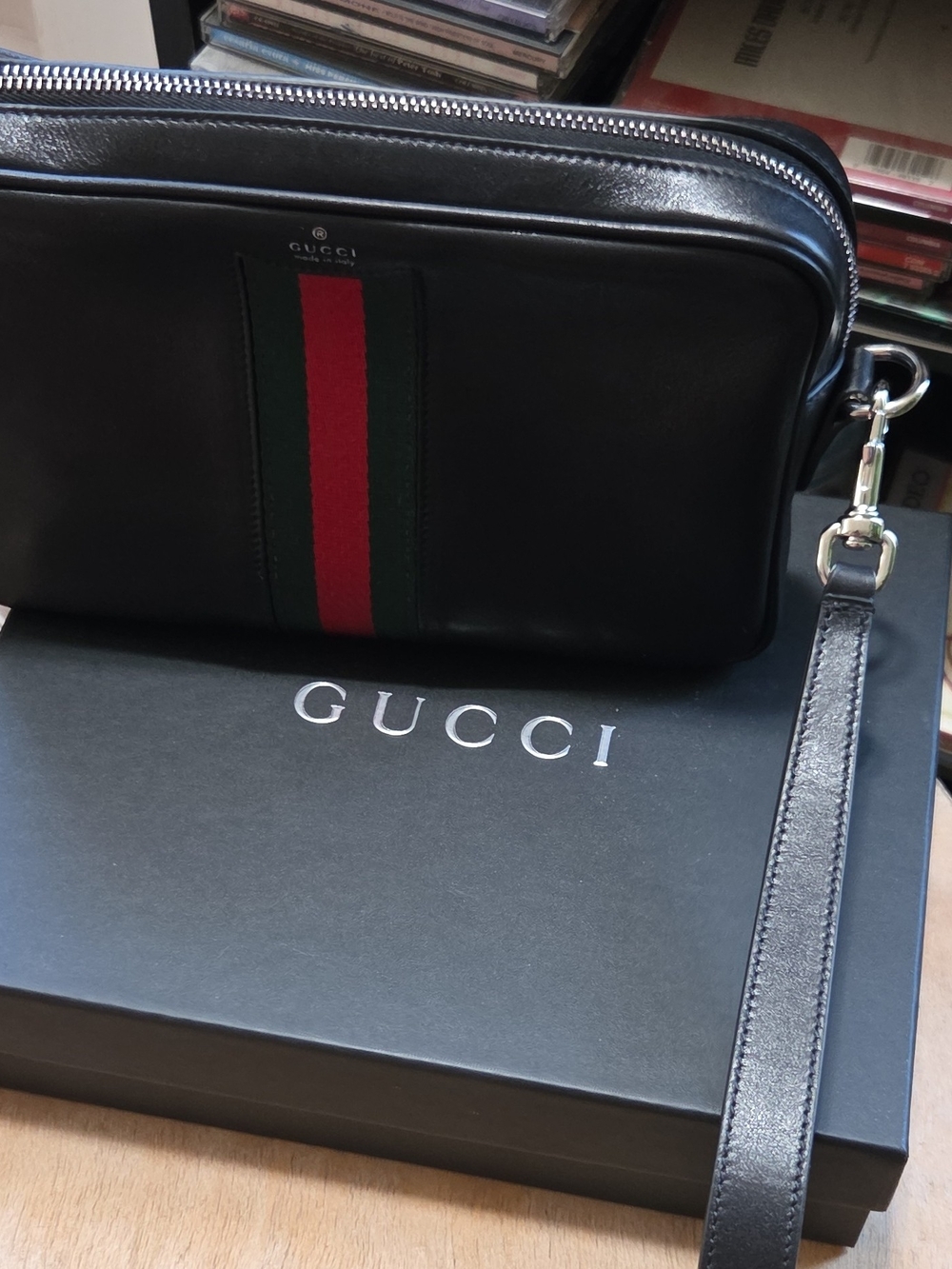 Authentic Gucci Black Leather Men's Wrist Pouch with Signature Web Stripe